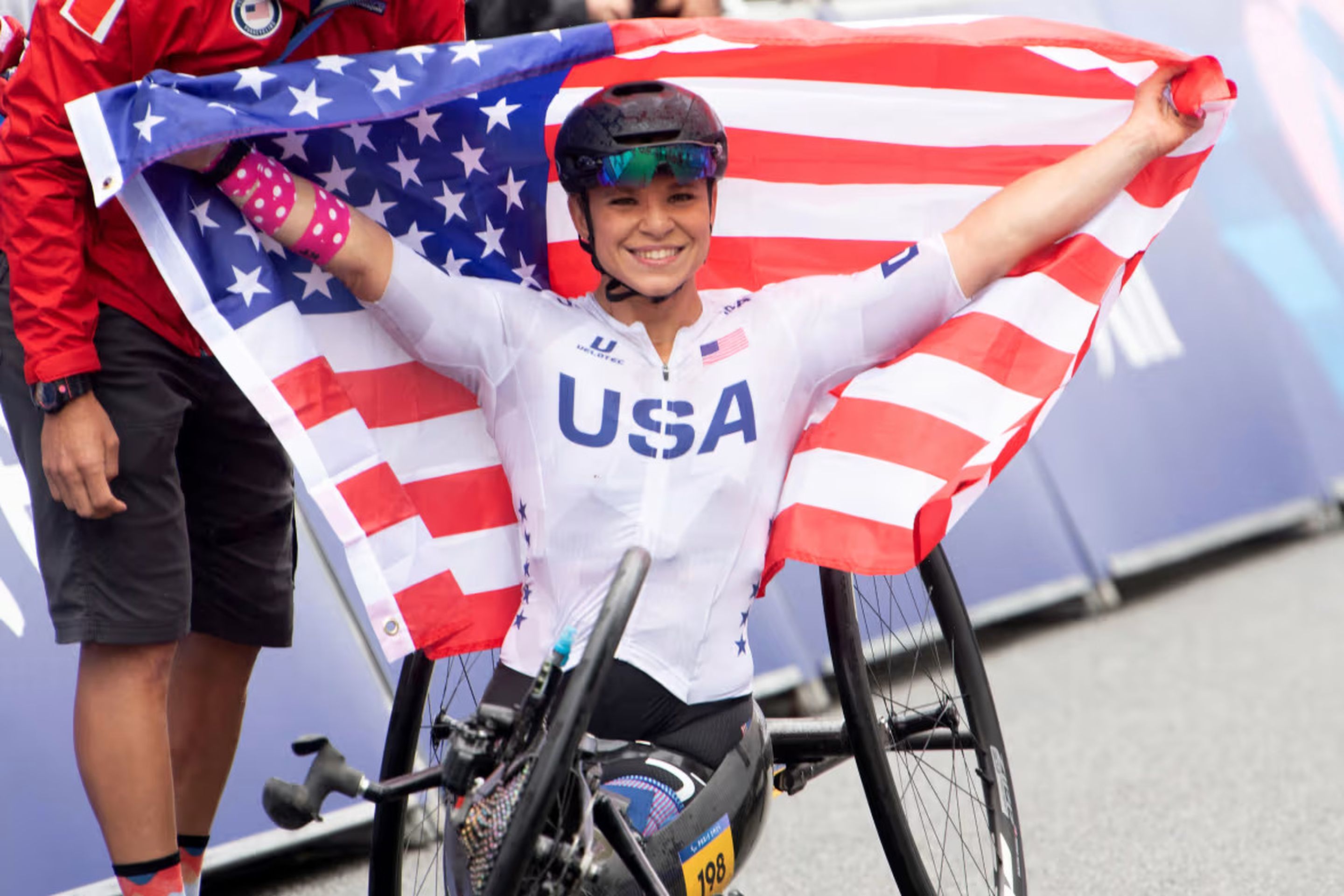 Oksana Masters (USA) on her hand-bike with the american flag