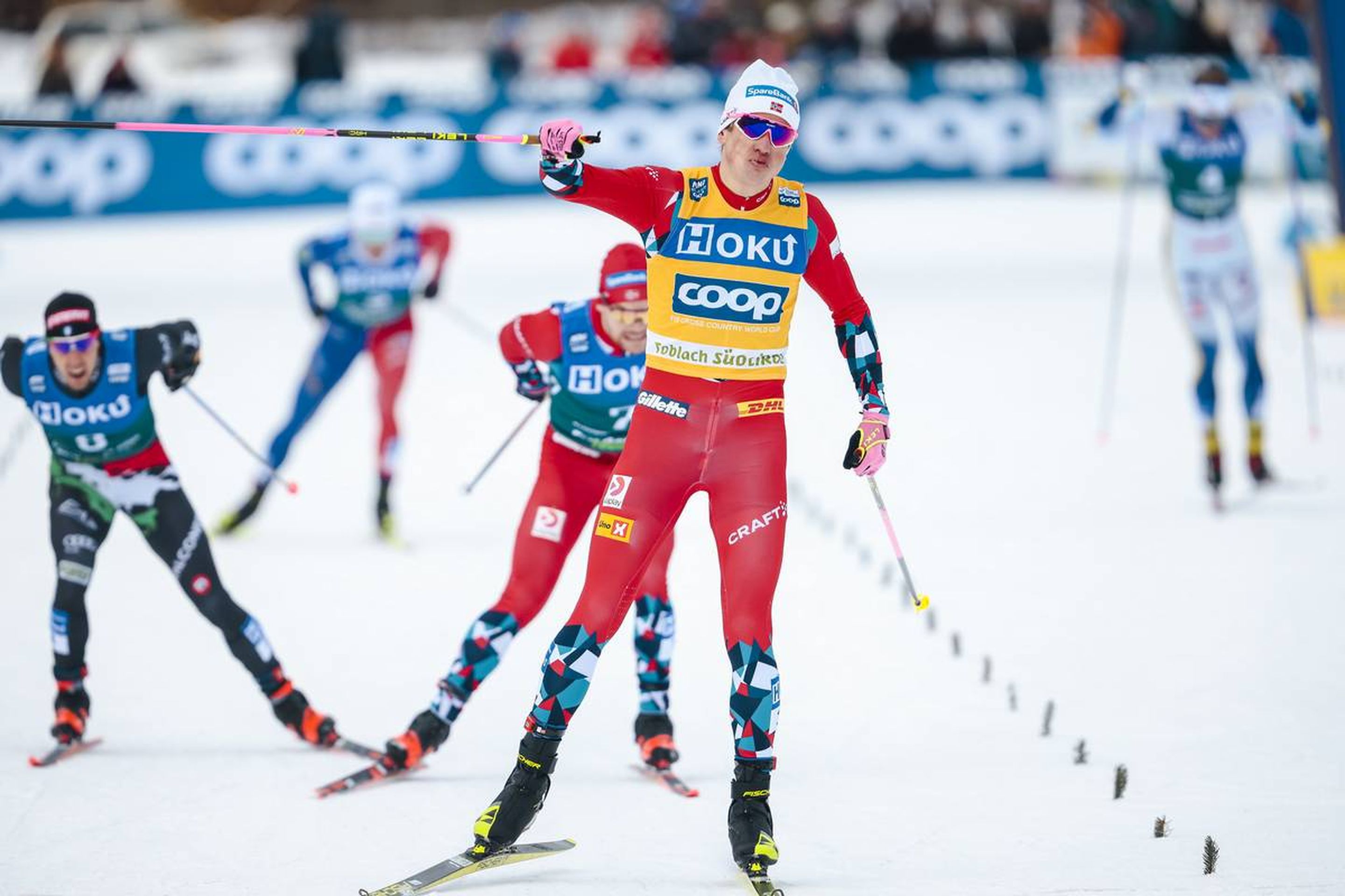 A familiar sight: Norway's Johannes Hoesflot Klaebo celebrates his sprint win before crossing the line to claim his 14th victory this season: @Nordic Focus.