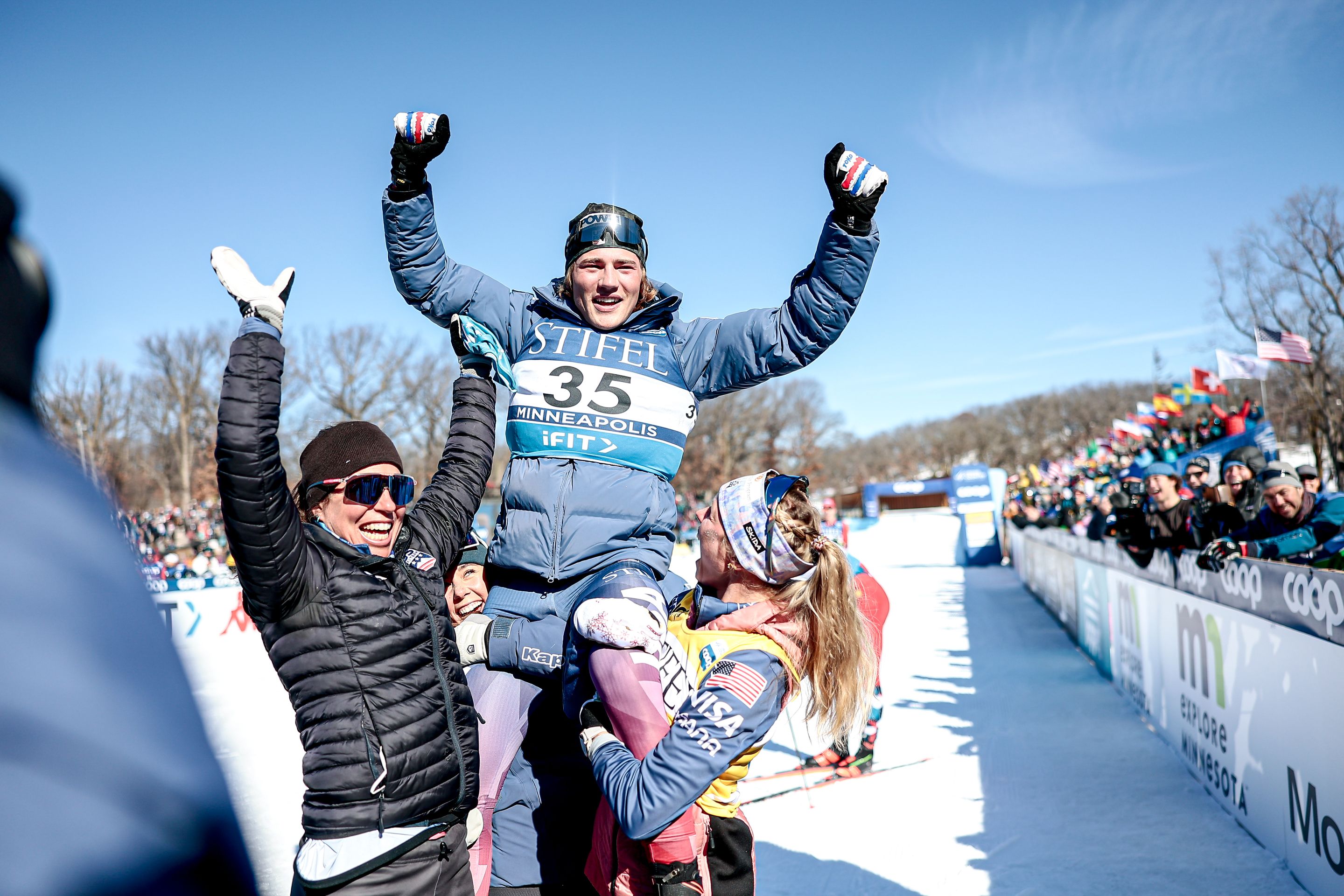 Schumacher celebrates victory with USA teammates Rosie Brennan (left) and Jessie Diggins @ Nordic Focus