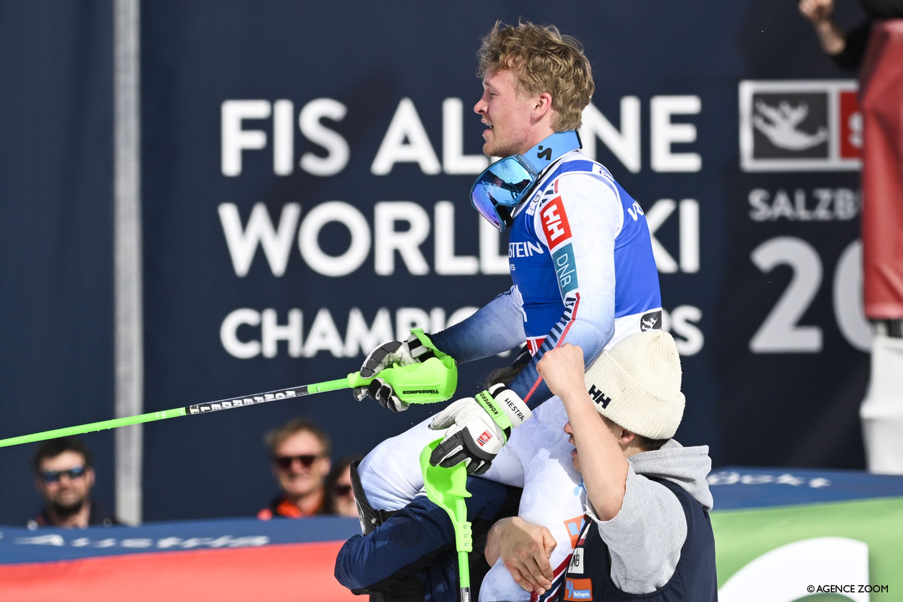 Haugan is held aloft by his teammates after his first World Cup victory