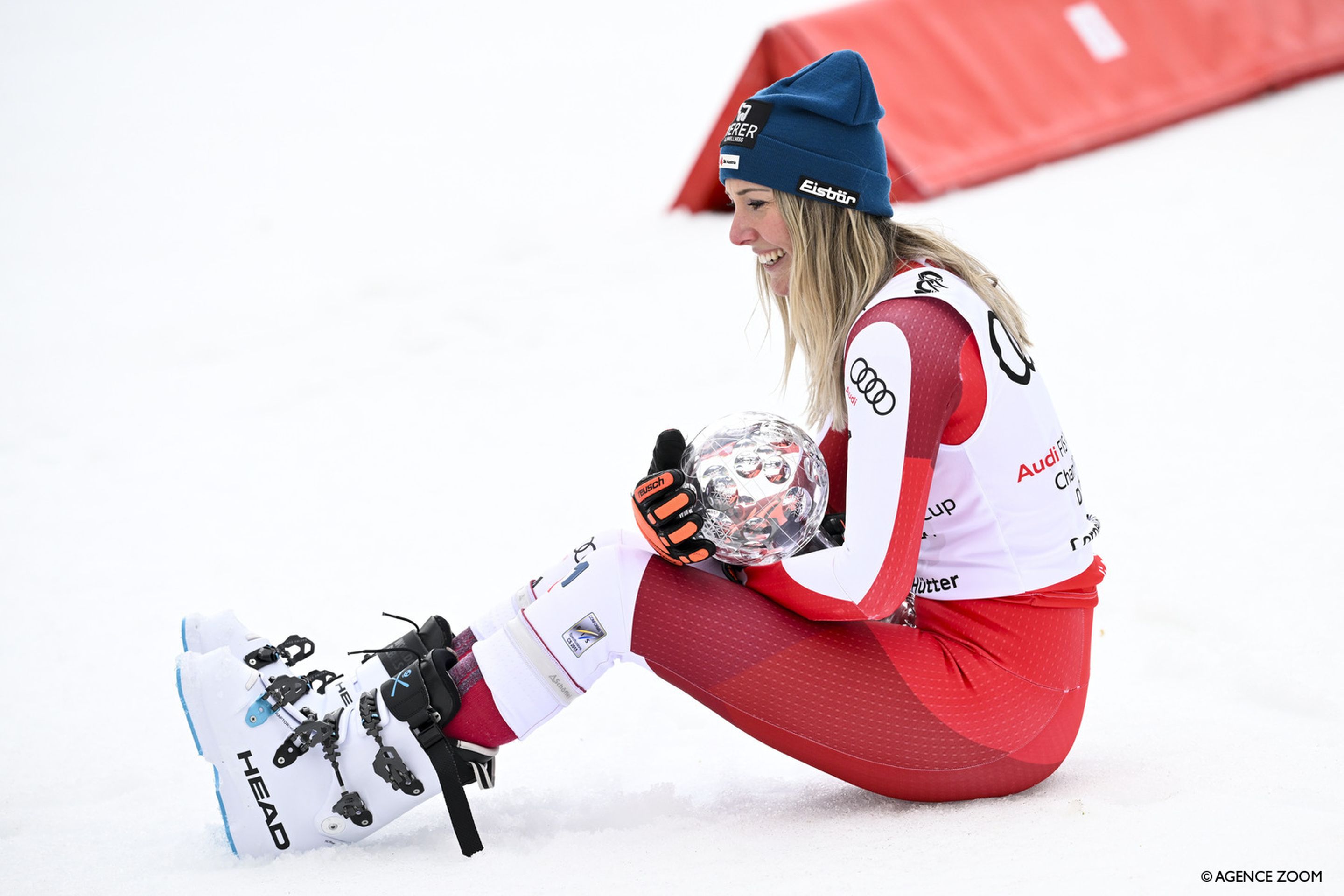Conny Huetter (AUT) cradles her first crystal globe like a baby