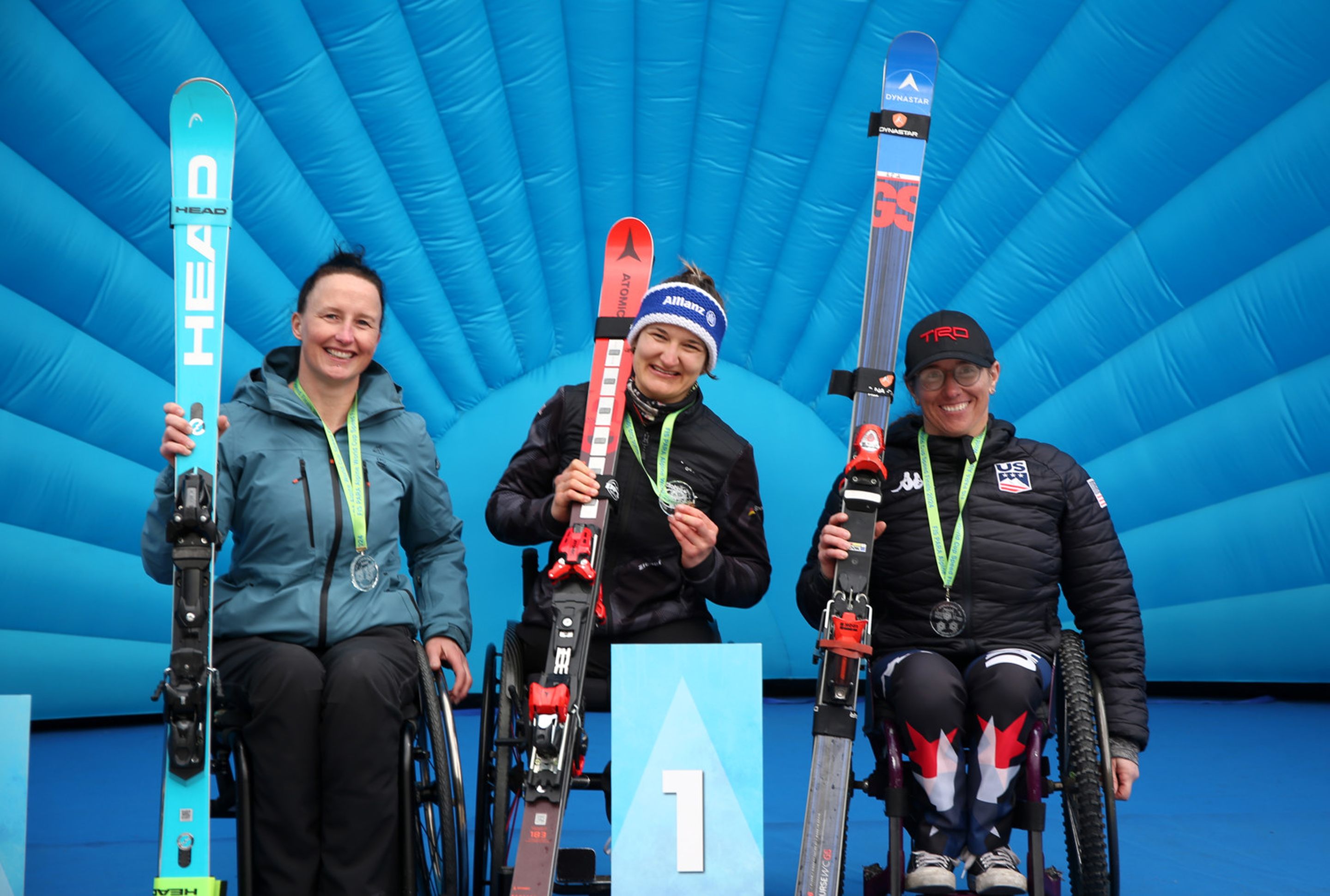Barbara Van Bergen (NED), Anna-Lena Forster (GER) and Laurie Stephens (USA) at the medals ceremony of the first giant slalom in Sella Nevea