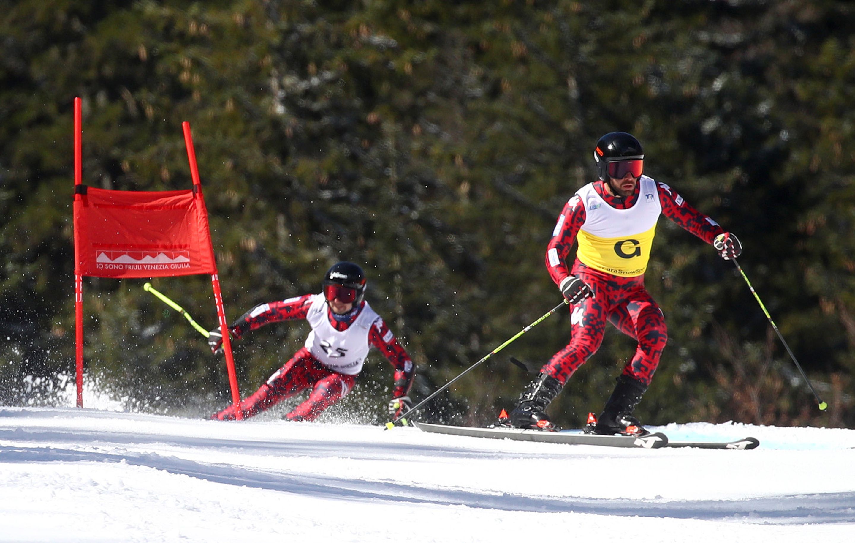 Giacomo Bertagnolli (ITA) following his guide Andrea Ravelli (ITA) on the first run of the last giant slalom in Sella Nevea