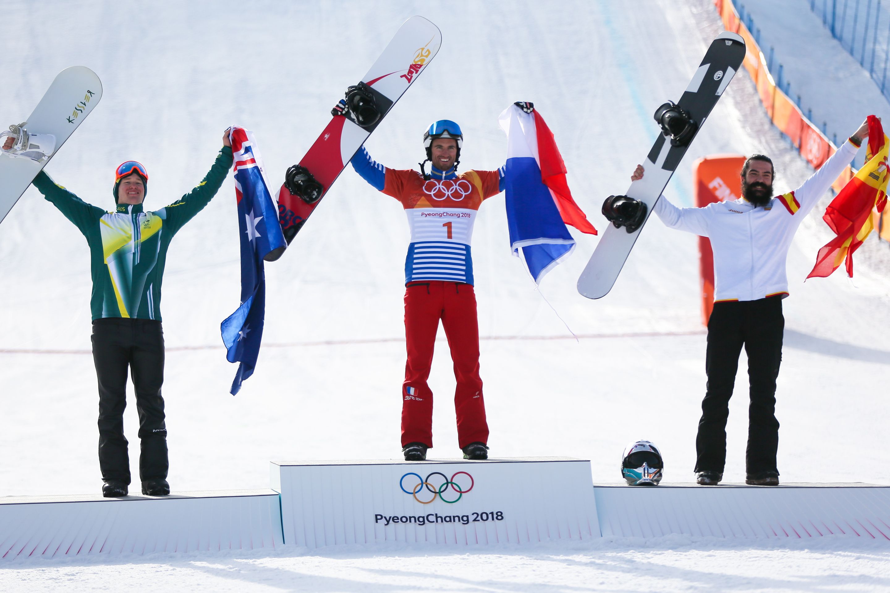 PYEONGCHANG-GUN, SOUTH KOREA - FEBRUARY 15: Jarryd Hughes of Australia wins the silver medal, Pierre Vaultier of France wins the gold medal, Regino Hernandez of Spain wins the bronze medal during the Snowboarding Men's Snowboard Cross Finals at Pheonix Snow Park on February 15, 2018 in Pyeongchang-gun, South Korea. (Photo by Laurent Salino/Agence Zoom)