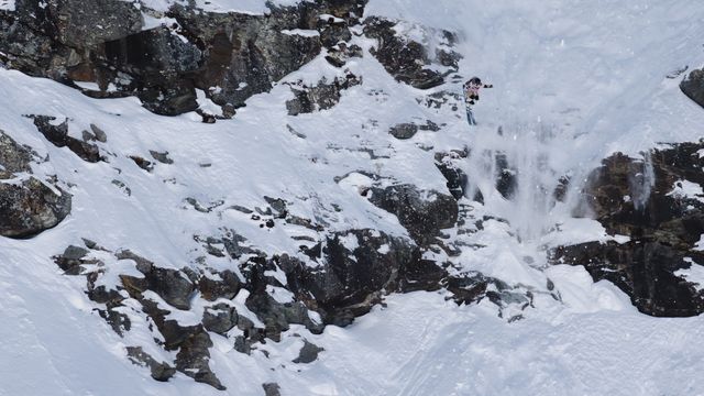 Freeride skier takes a jump during Xtreme Verbier
