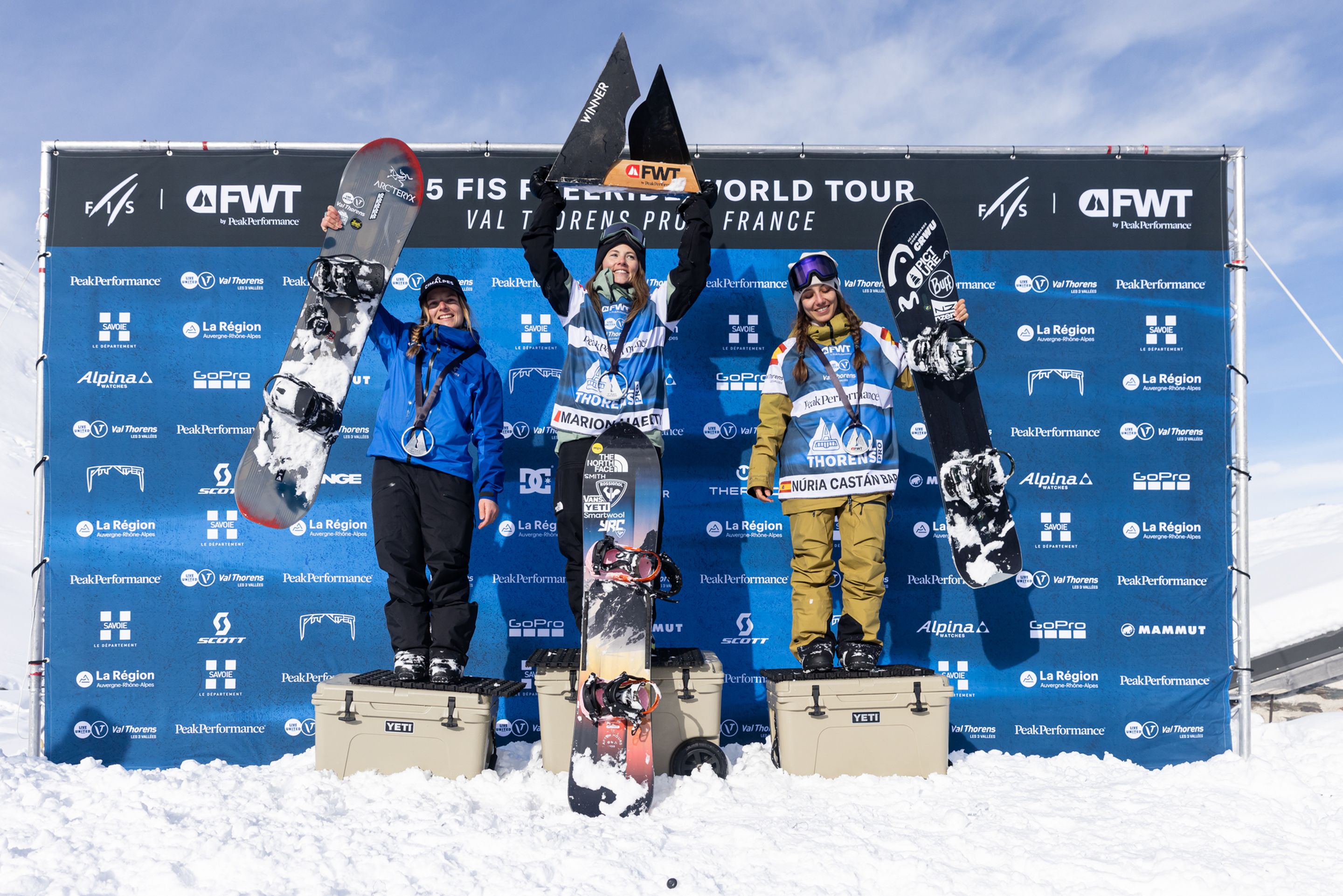 Women celebrate on podium