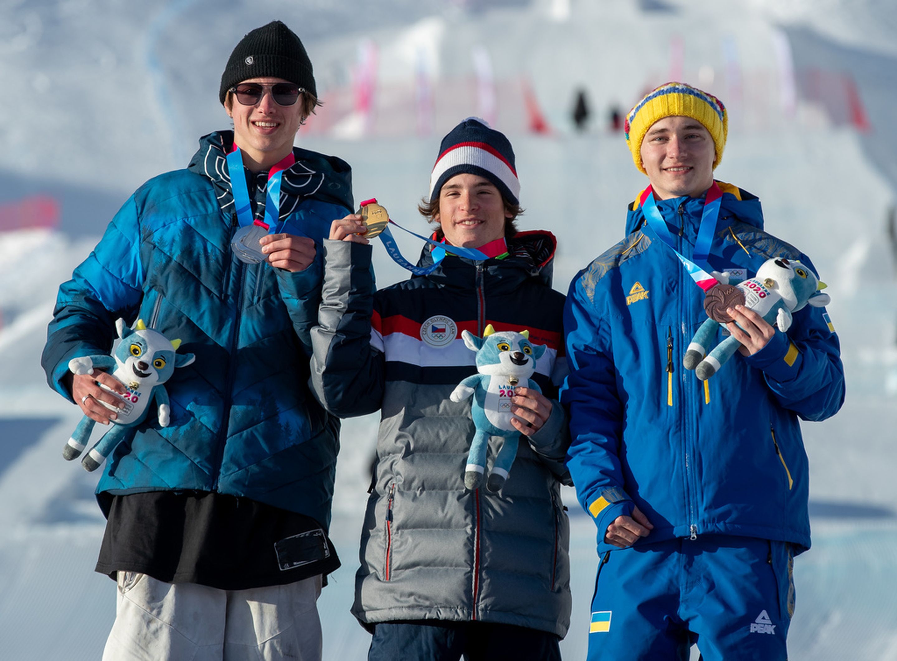 Men's big air podium: 2nd Kiernan Fagan (USA), 1st Matej Svancer (CZE), 3rd Orest Kovalenko (UKR) © OIS