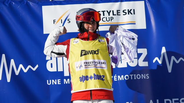 Anri Kawamura wearing the World Cup leader's yellow bib following victory in Alpe d'Huez