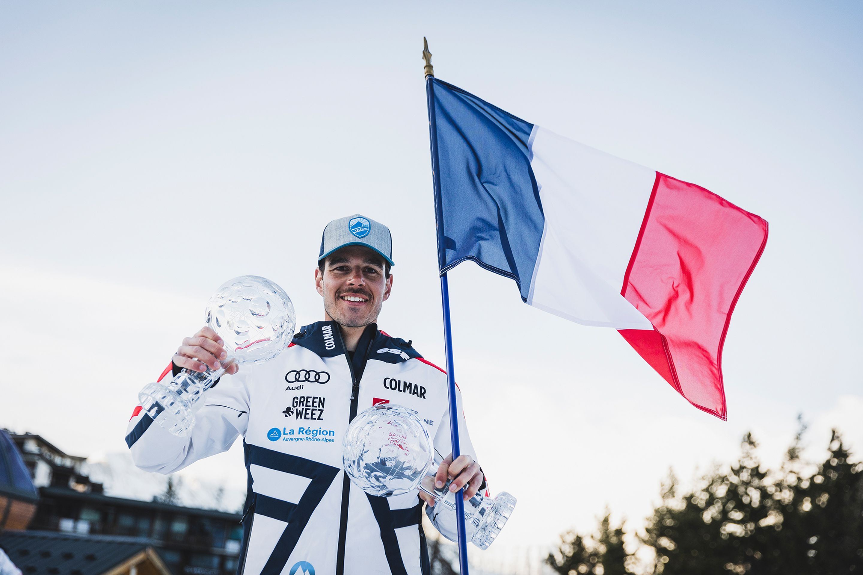 Elie Nabot (FRA) with the French flag, showing his two crystal globes