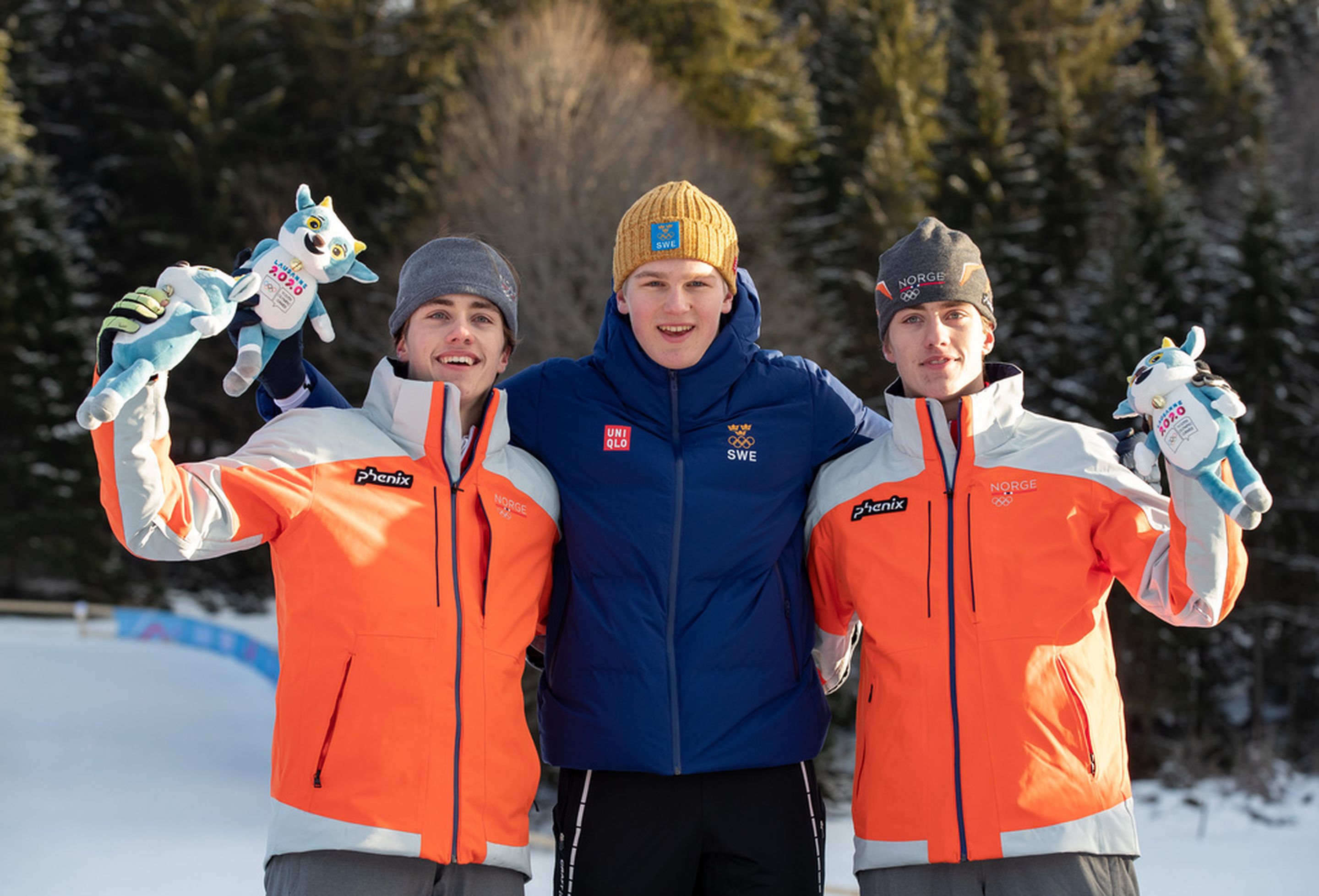 Silver medal winner Nikolai Holmboe NOR (left), Gold medal winner Edvin Anger SWE (centre) and Bronze medal winner Aleksander Holmboe NOR (right) at the mascot ceremony for the Cross-Country Skiing Men’s Sprint at the Vallee de Joux Cross-Country Centre. The Winter Youth Olympic Games, Lausanne, Switzerland, Sunday 19 January 2020. Photo: OIS/Ben Queenborough. Handout image supplied by OIS/IOC.