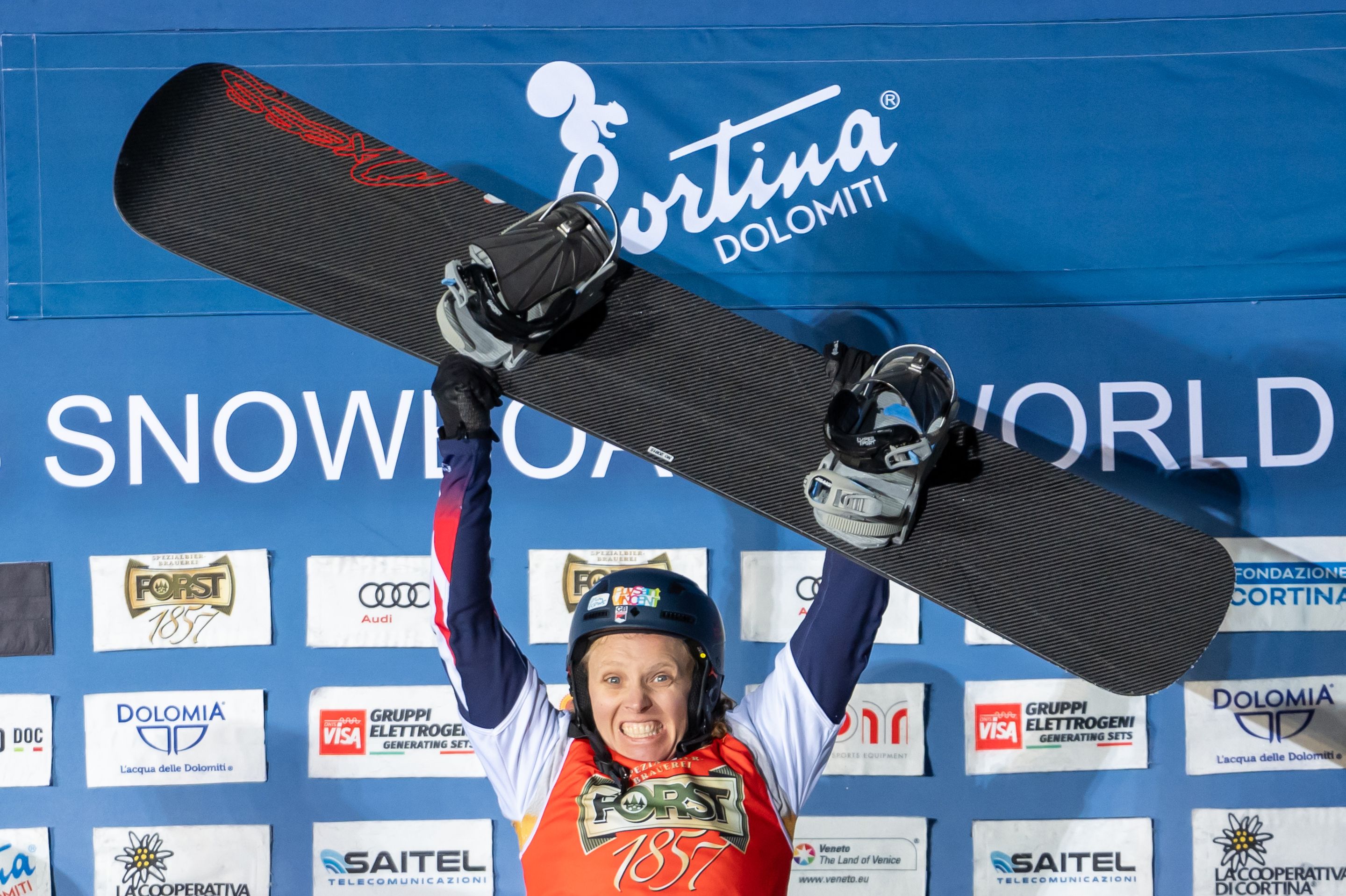 Britain's Charlotte Bankes celebrates on the podium in Cortina