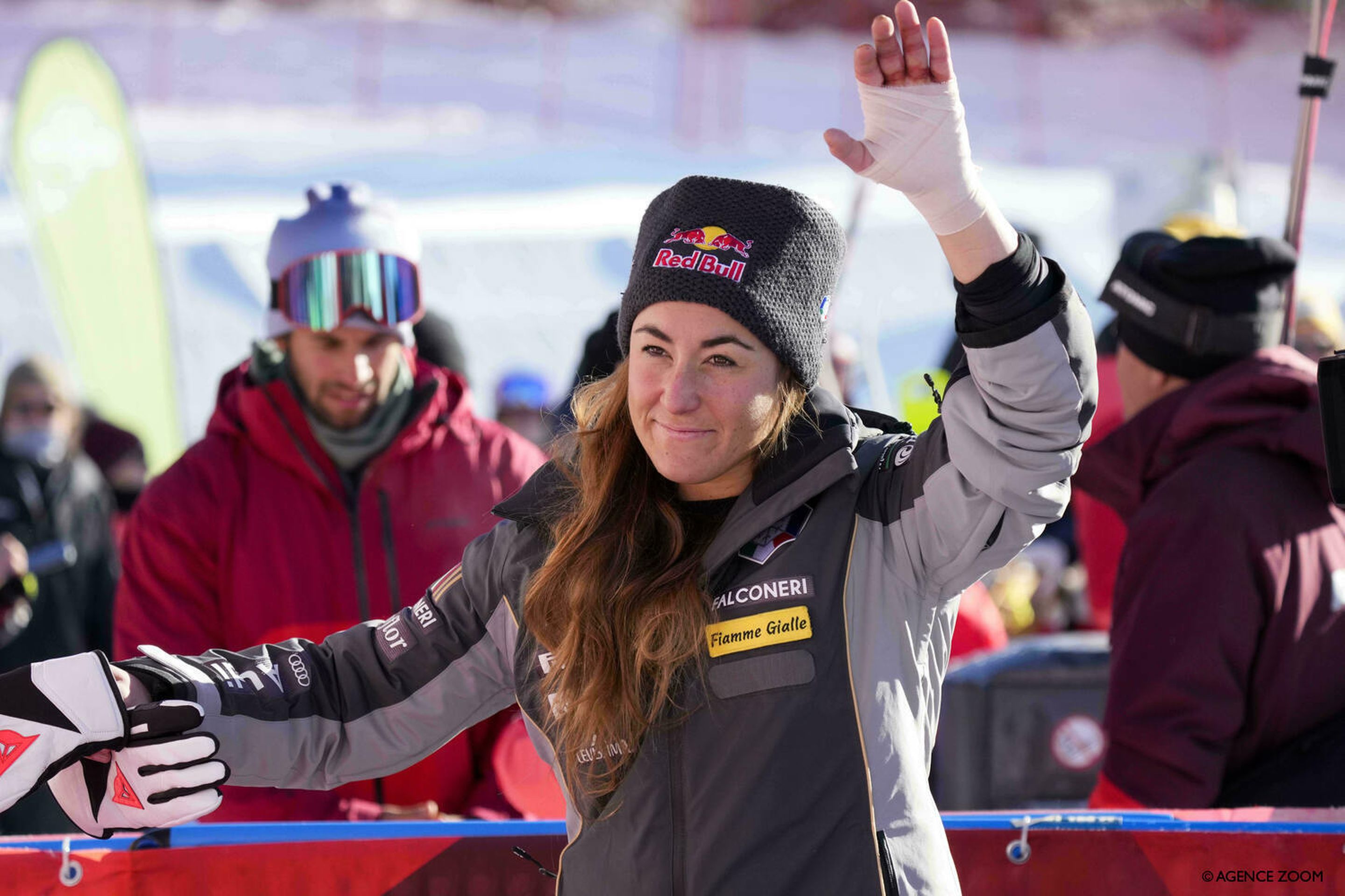 Sofia Goggia waves with her bandaged, broken hand after winning Saturday's downhill (Agence Zoom)