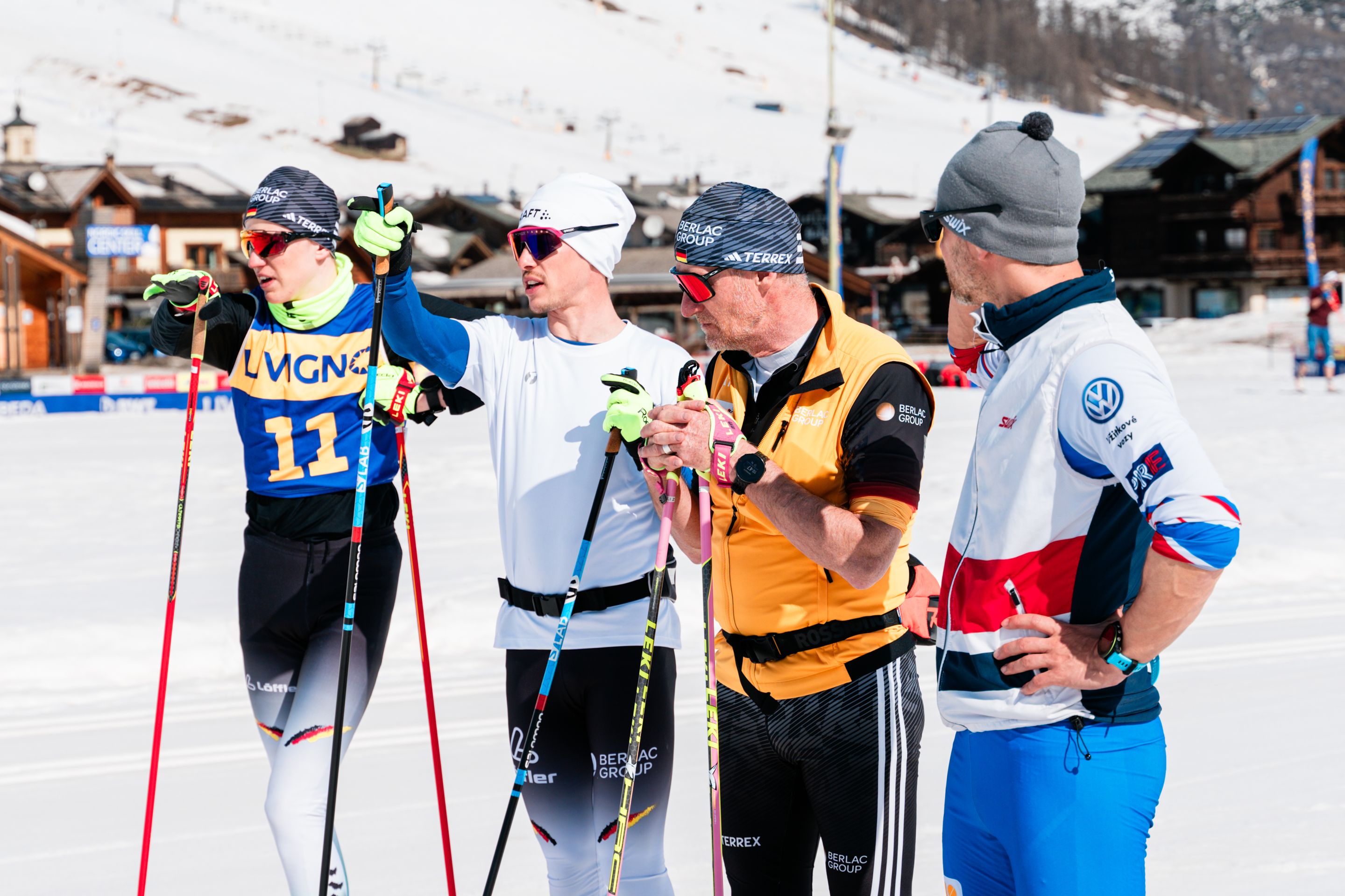 Four guides discussing on the nordic stadium of Livigno