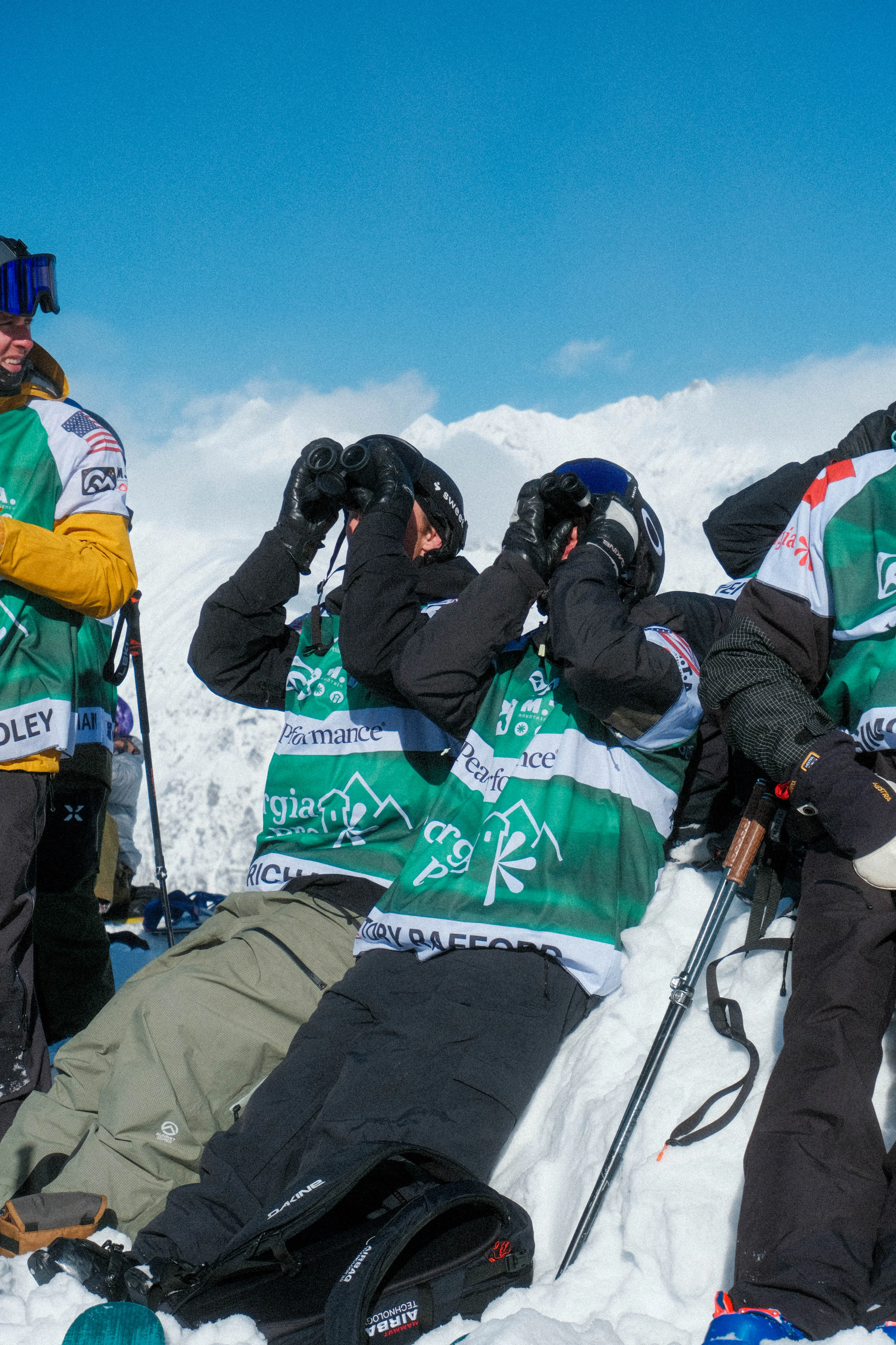 Richards and Rafford look up using binoculars