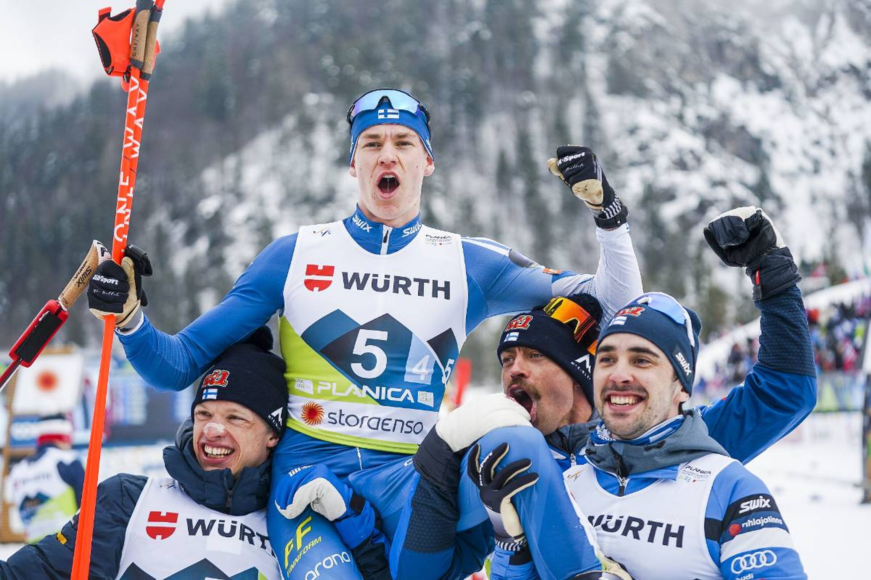 Finland's (from left) Iivo Niskanen, Perttu Hyvarinen and Ristomatti Hakola carry Niko Anttola to celebrate their silver medal: @Nordic Focus.