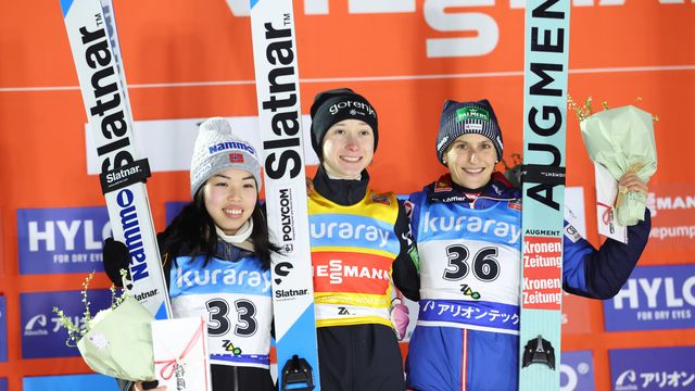The podium in Zao on Friday, with Prevc wearing the yellow jersey.