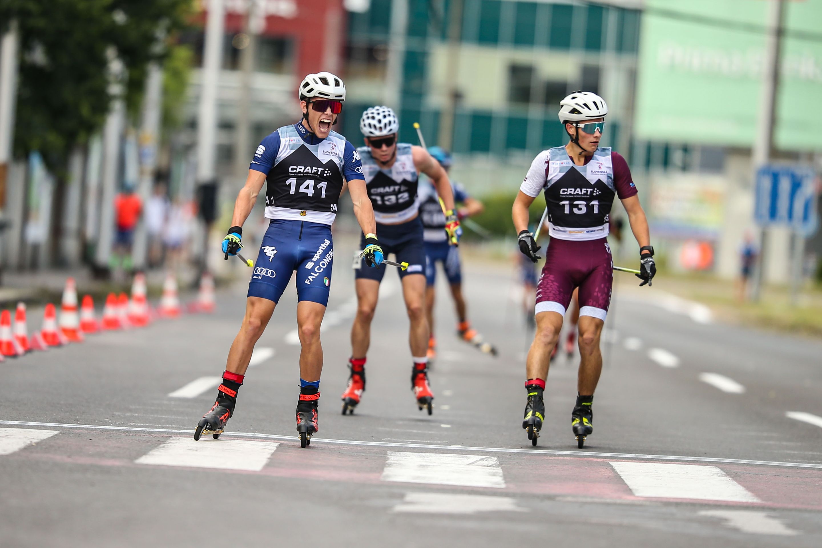 Aksel Artusi crossing the finish line in the mens junior race