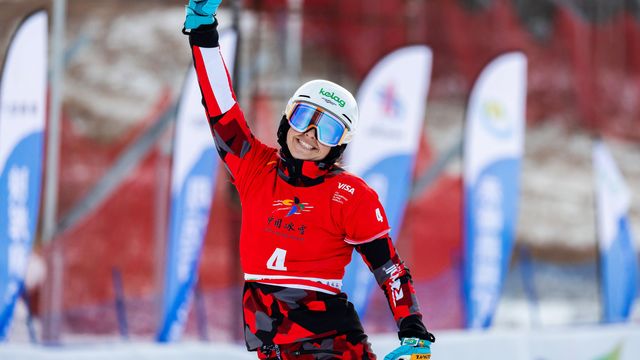 Sabine Payer raises fist in triumph in Mylin.