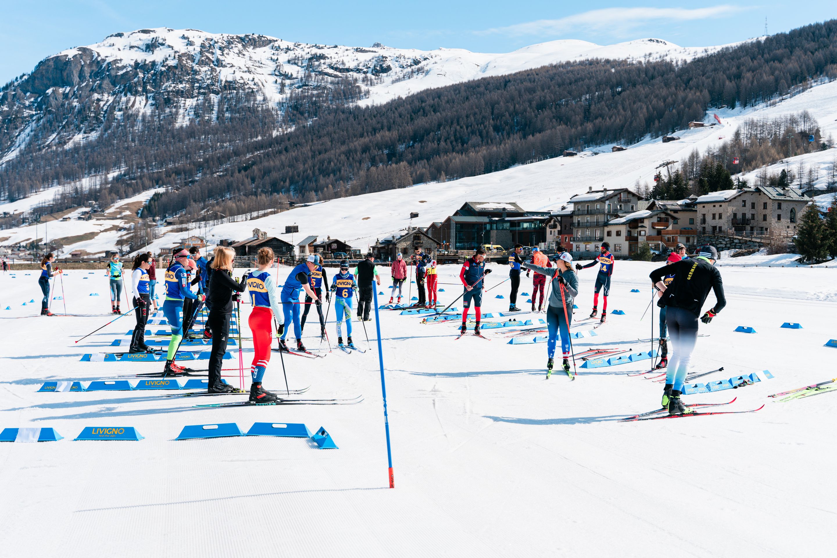 Athletes in the transition zone before the Skiathlon on Livigno's nordic stadium