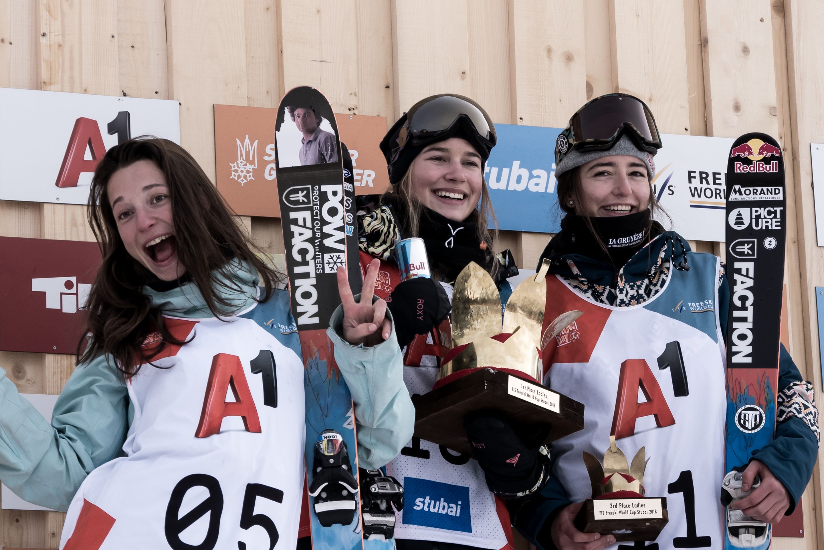 Ladies' podium in Stubai with 2nd Sarah Hoefflin (SUI), 1st Kelly Sildaru (EST) and 3rd Mathilde Gremaud (SUI)