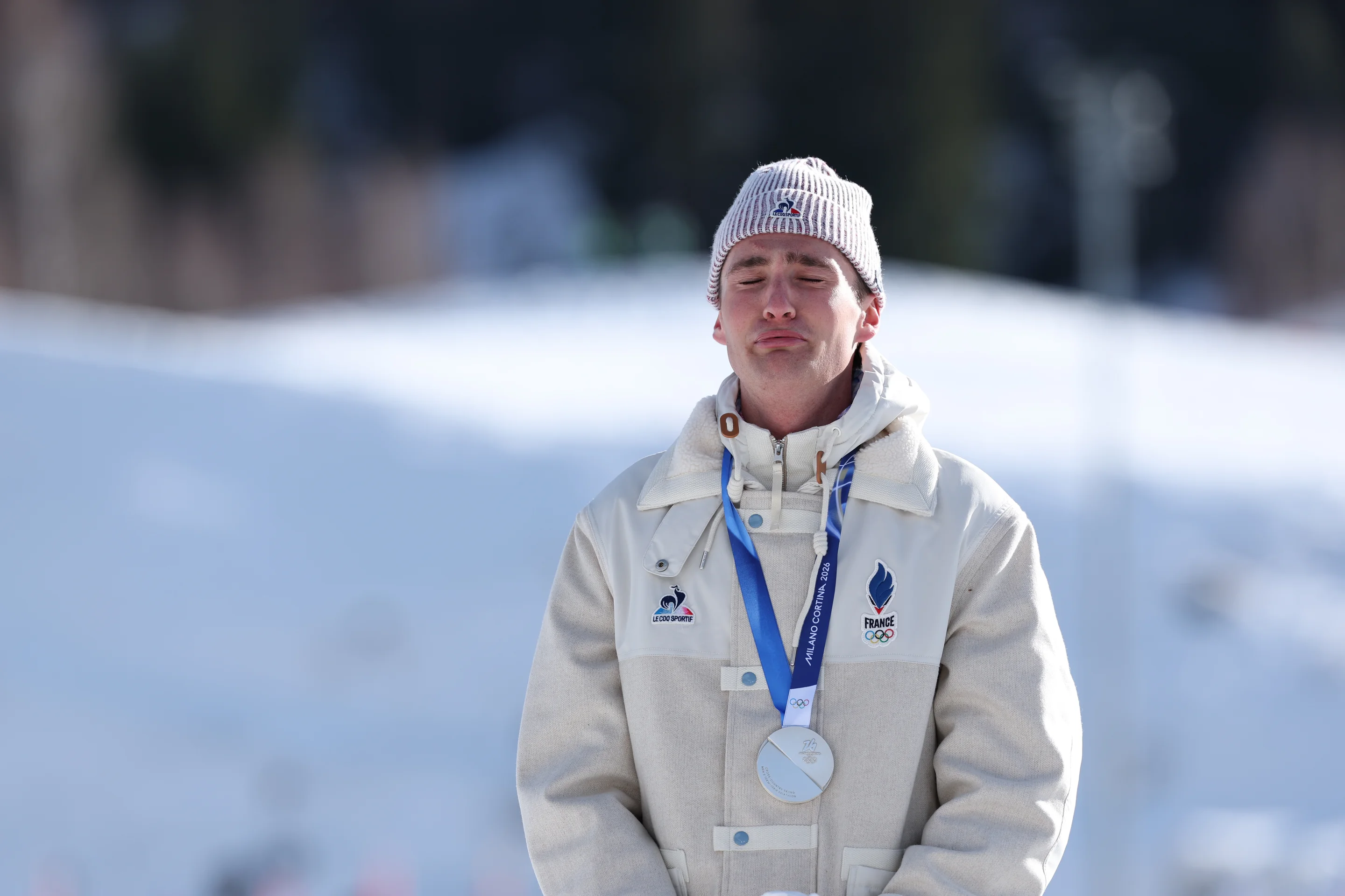 Mathis Desloges looks emotional while wearing his silver medal