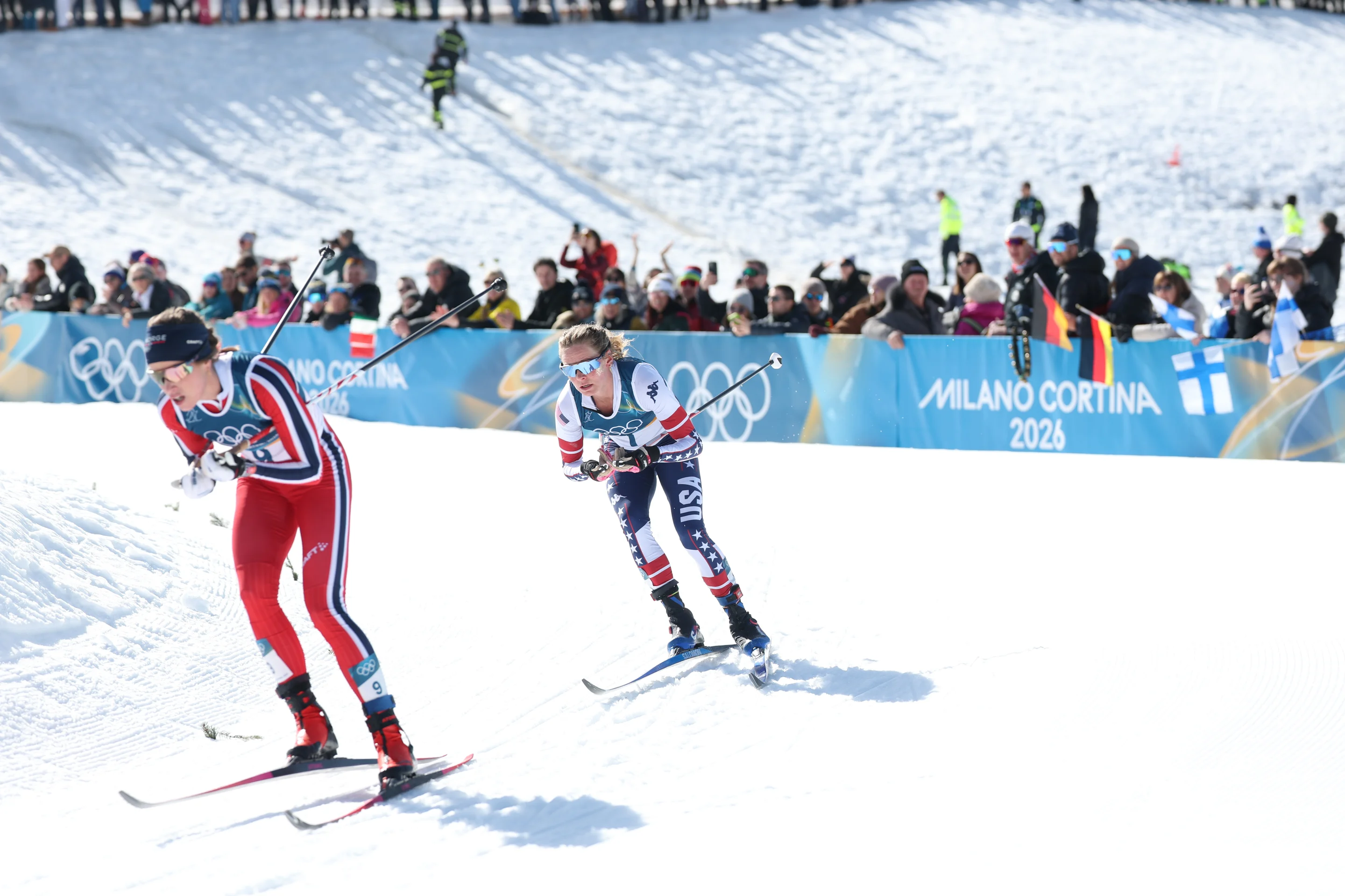 Jessie Diggins takes a bend behind Kristin Austgulen Fosnaes