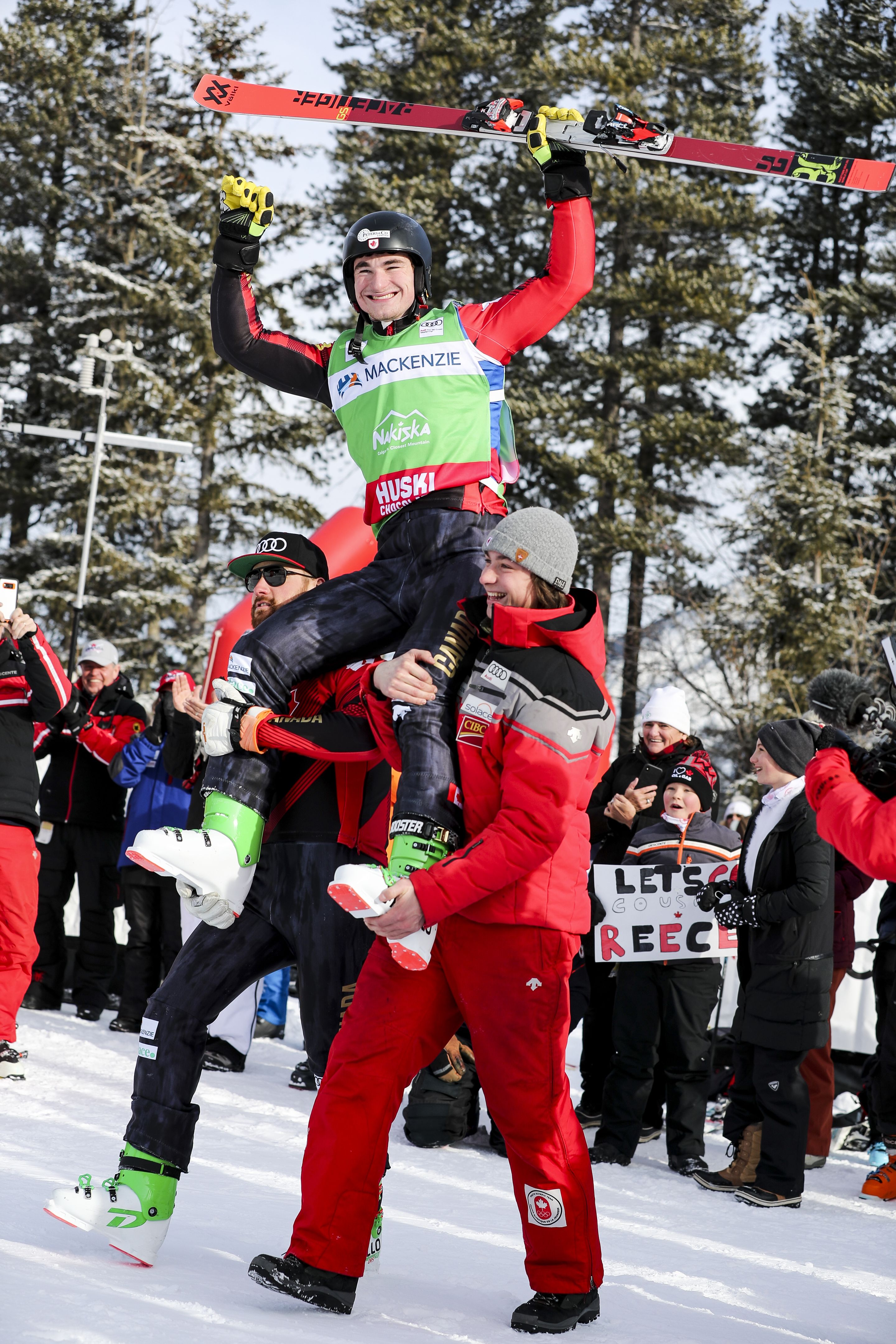 ©GEPA: Reece Howden (CAN) being carried to the podium by his team mates.