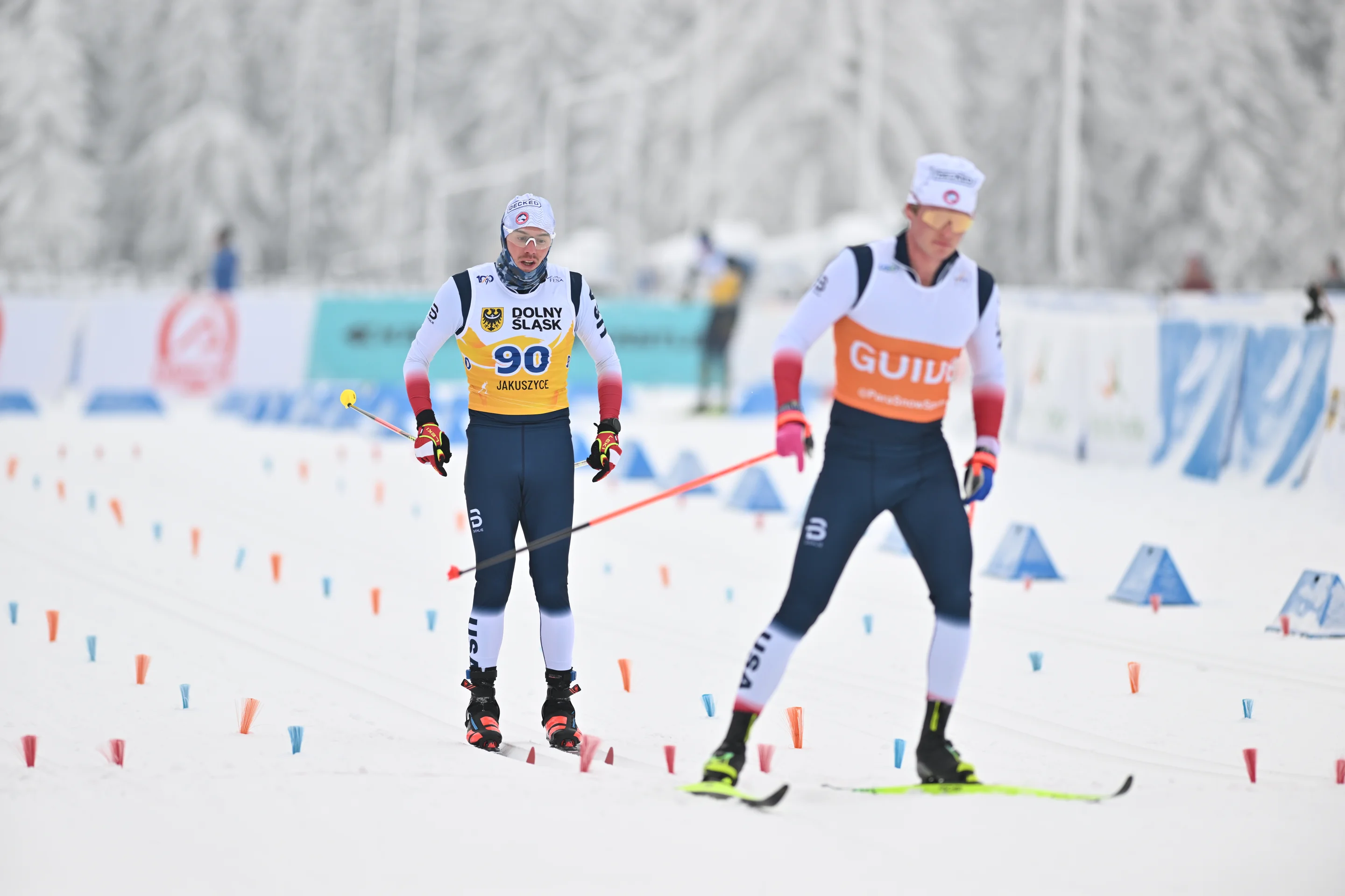 Adicoff skiing behind his guide