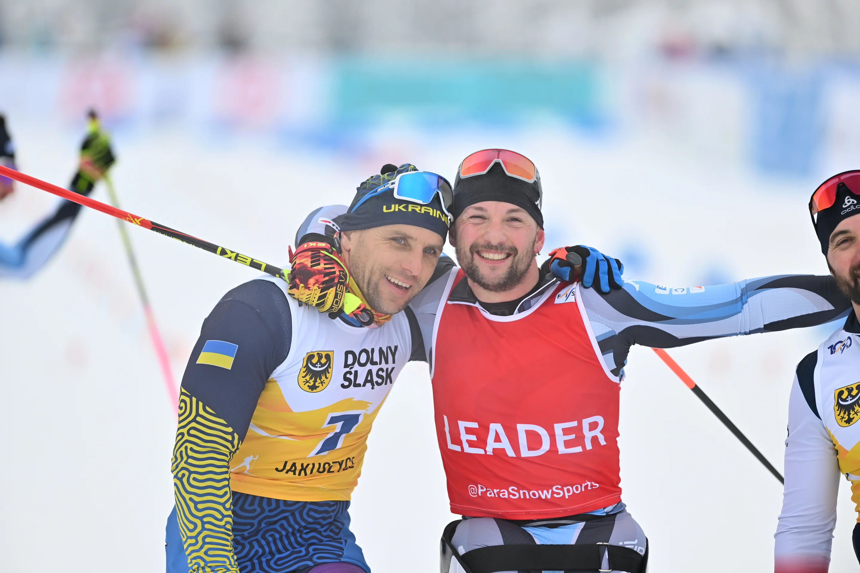 Bal and Romele with their arms round each other's shoulder