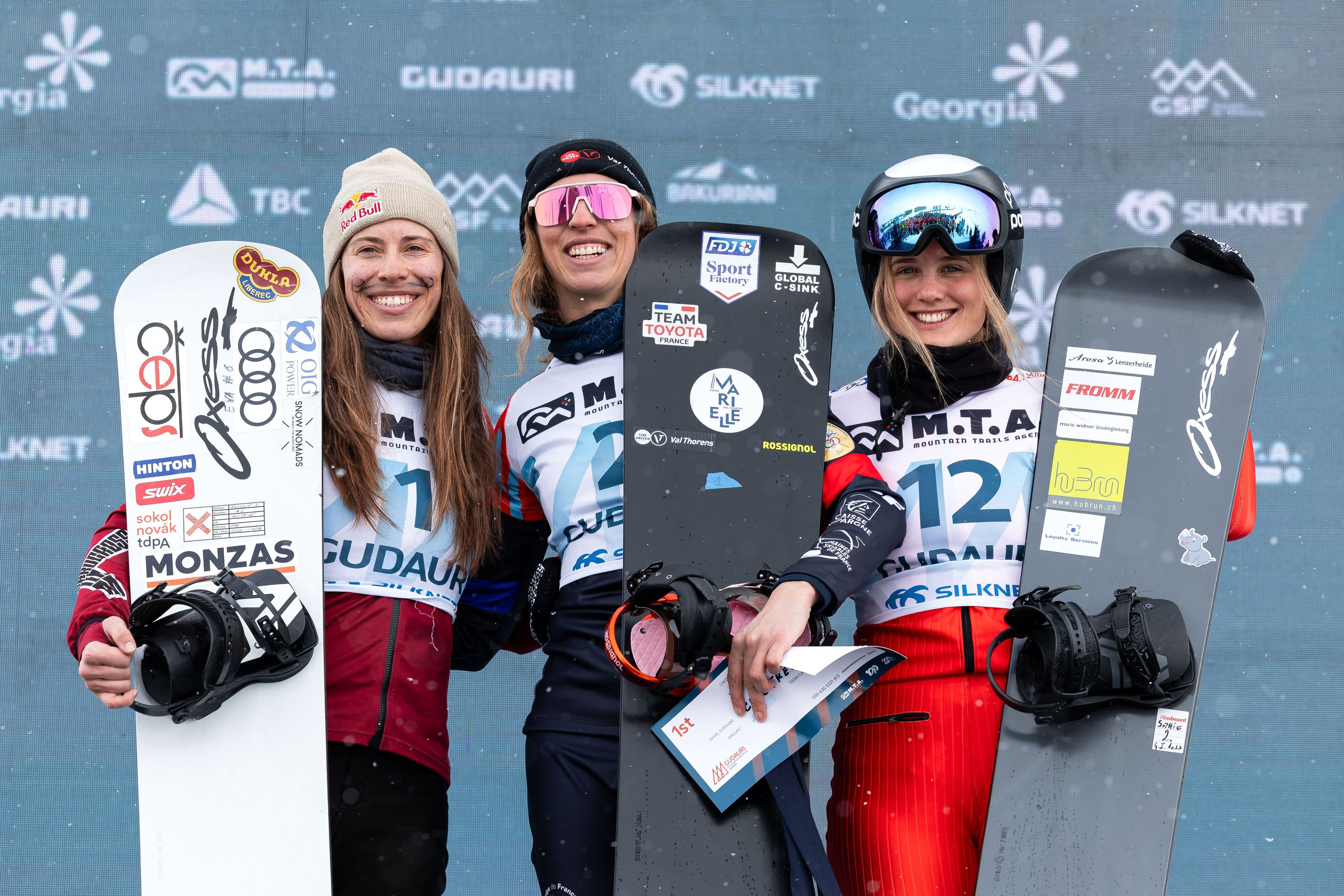 Chloe Trespeuch (FRA) tops the podium ahead of Eva Adamczykova (CZE) and Sophie Hediger (SUI).. © Miha Matavz/FIS