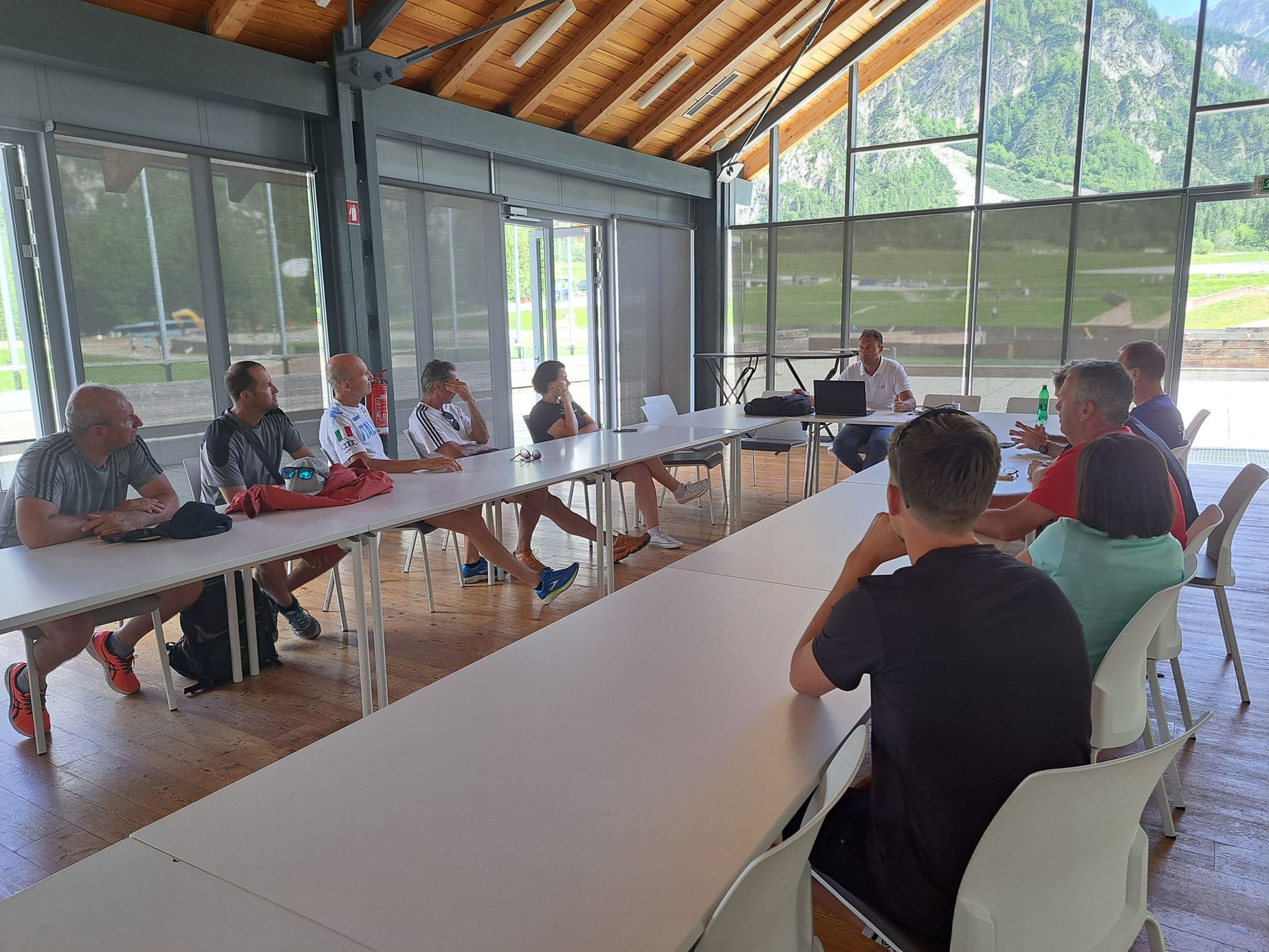 Ski Jumping Race Director Sandro Pertile (FIS) meeting with the coaches.