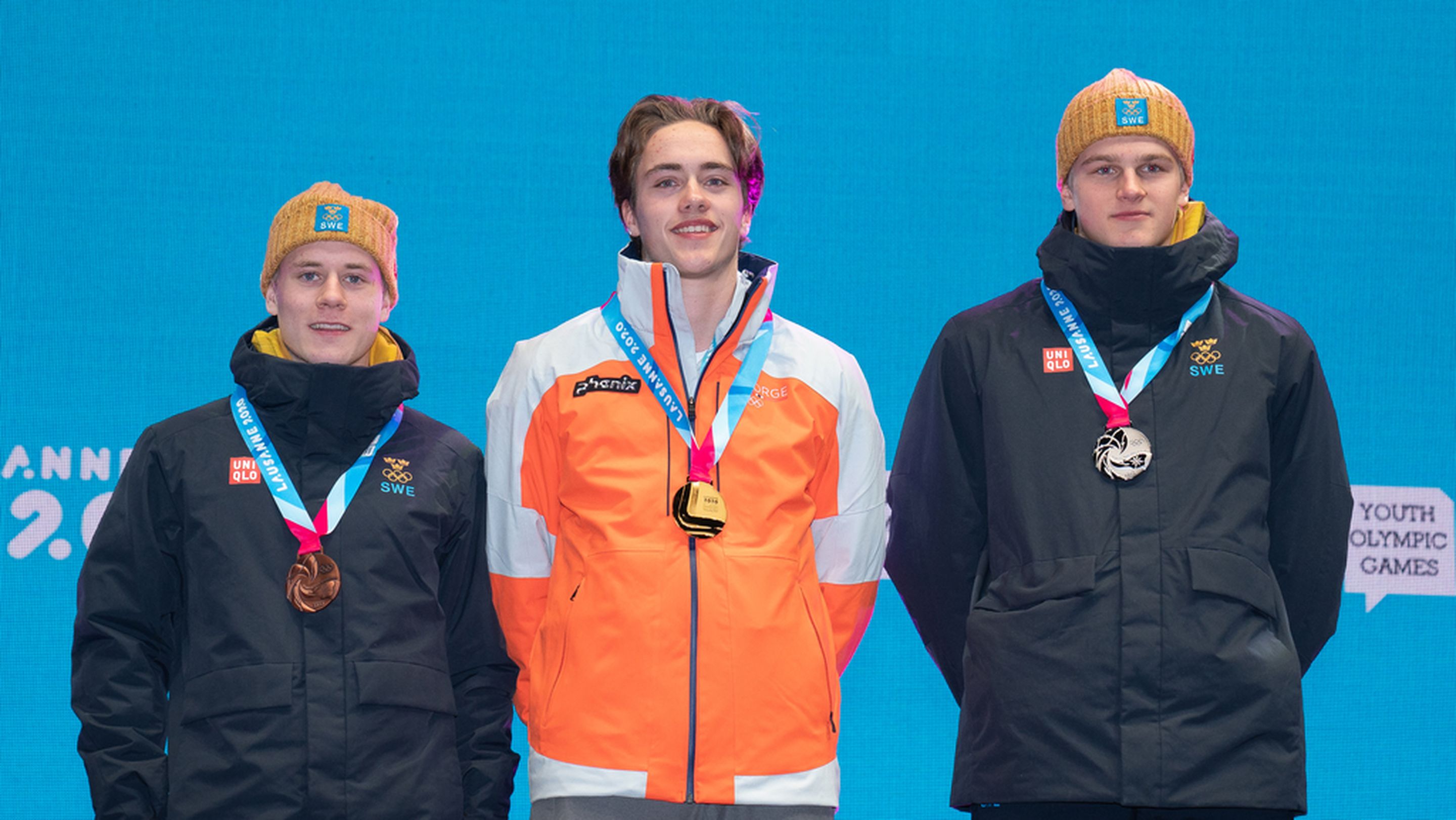 Gold medallist Nikolai Holmboe NOR (centre), silver medallist Edvin Anger SWE (left) and bronze medallist Albin Aastroem SWE  (right) on the podium during the medal ceremony for the Cross-Country Skiing Men’s Cross Free at Medal Plaza. The Winter Youth Olympic Games, Lausanne, Switzerland, Saturday 18 January 2020. Photo: OIS/Joe Toth. Handout image supplied by OIS/IOC.