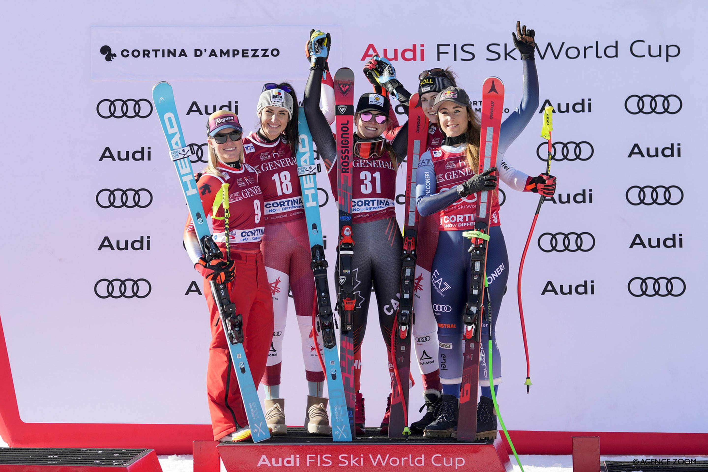 Five racers celebrate on a crowded Cortina d'Ampezzo downhill podium (Agence France)