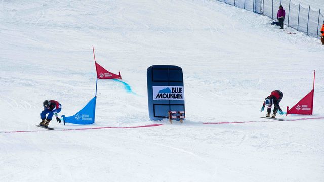 Benjamin Karl and Marko Felicetting crossing the finish line for a tie in Saturday’s PGS race in Blue Mountai © Matt Forsythe / Canada Snowboard
