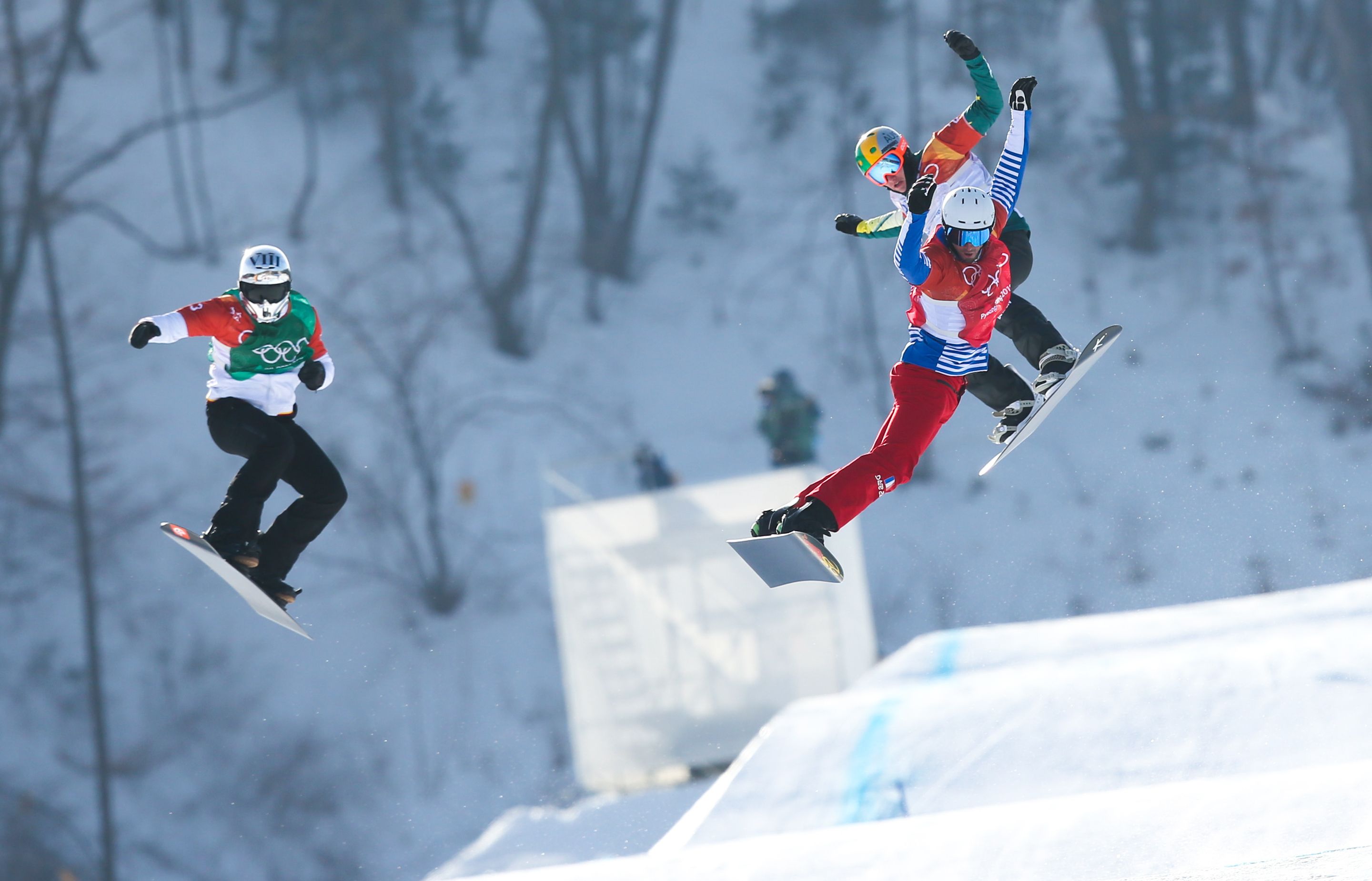 PYEONGCHANG-GUN, SOUTH KOREA - FEBRUARY 15: Regino Hernandez of Spain, Pierre Vaultier of France, Jarryd Hughes of Australia compete during the Snowboarding Men's Snowboard Cross Finals at Pheonix Snow Park on February 15, 2018 in Pyeongchang-gun, South Korea. (Photo by Laurent Salino/Agence Zoom)