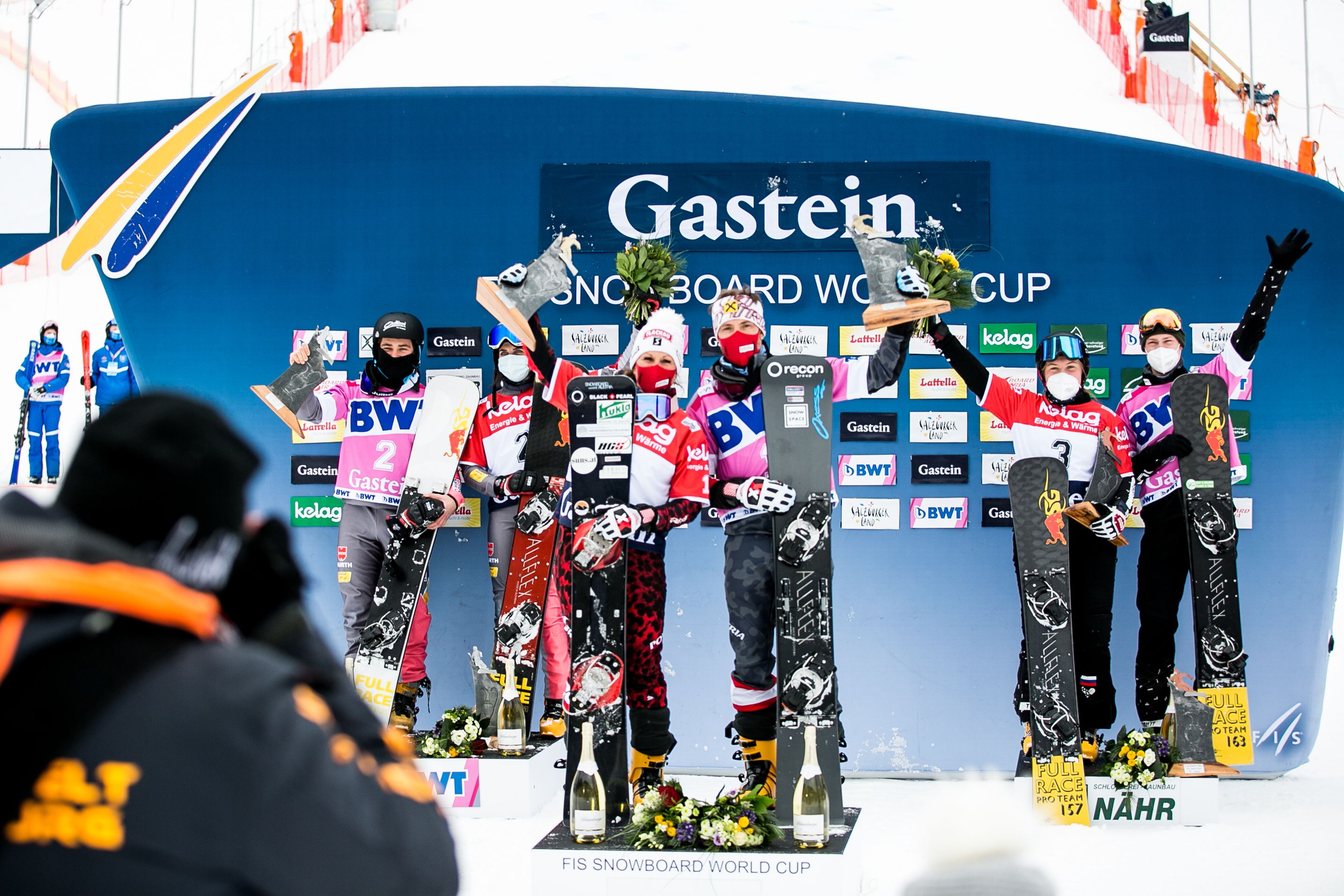 Podium at the FIS Snowboard Parallel Slalom Mixed Team World Cup event in Bad Gastein (AUT).ltr 2nd Germany (Baumeister,Loch), 1st Austria (Riegler, Prommegger), 3rd Russia (Nadyrshina, Loginov). Photo: Chad Buchholz (FIS)