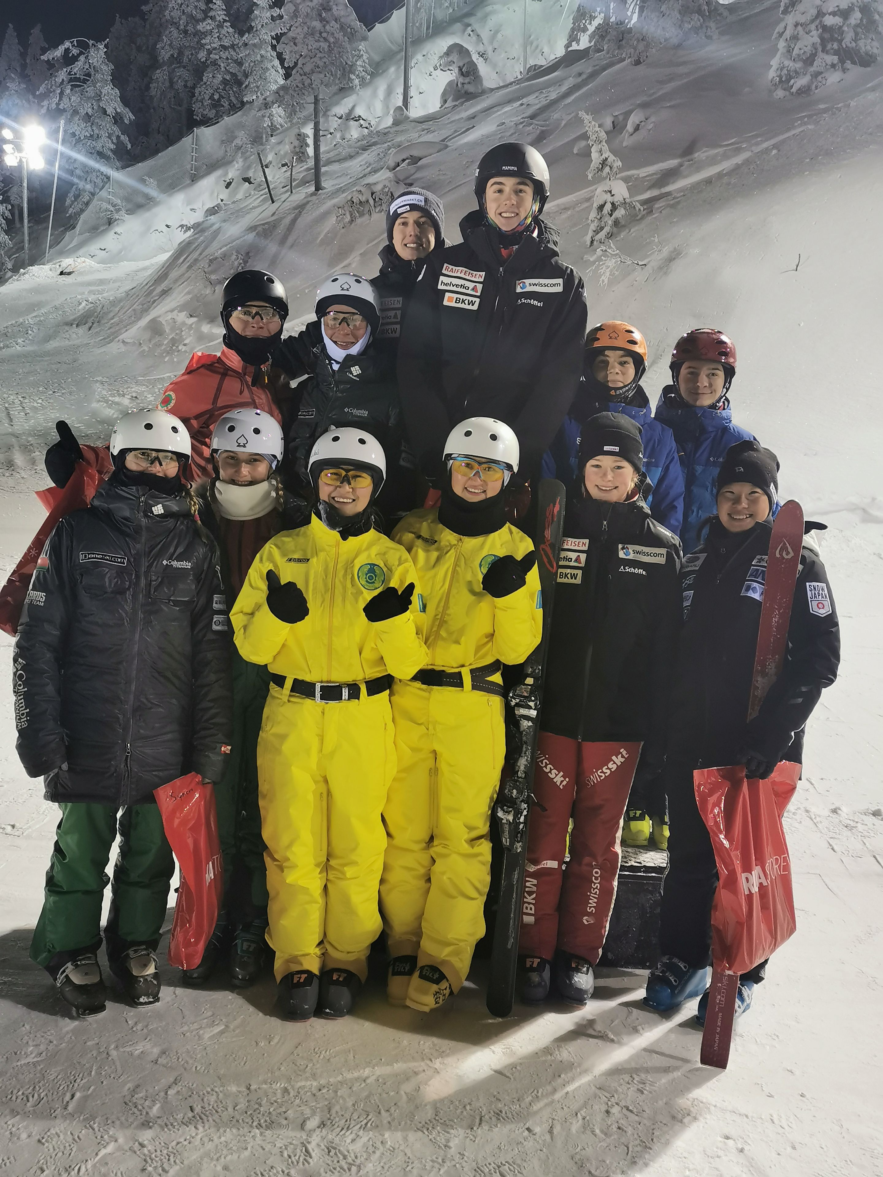 Women's and men's podium from the synchro team competition