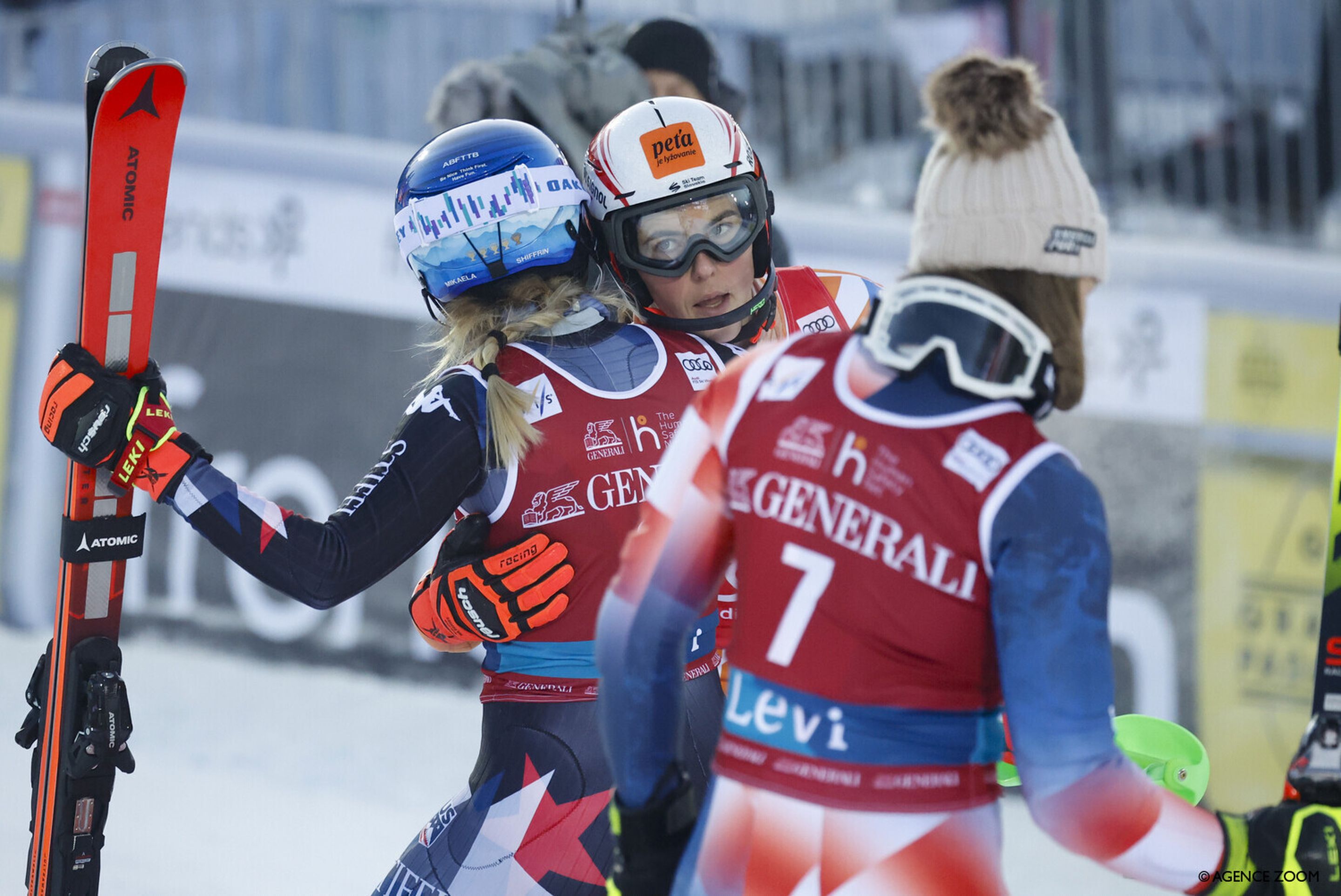 Shiffrin and Vlhova embrace in the finish area after Vlhova's straddle handed the race to the American