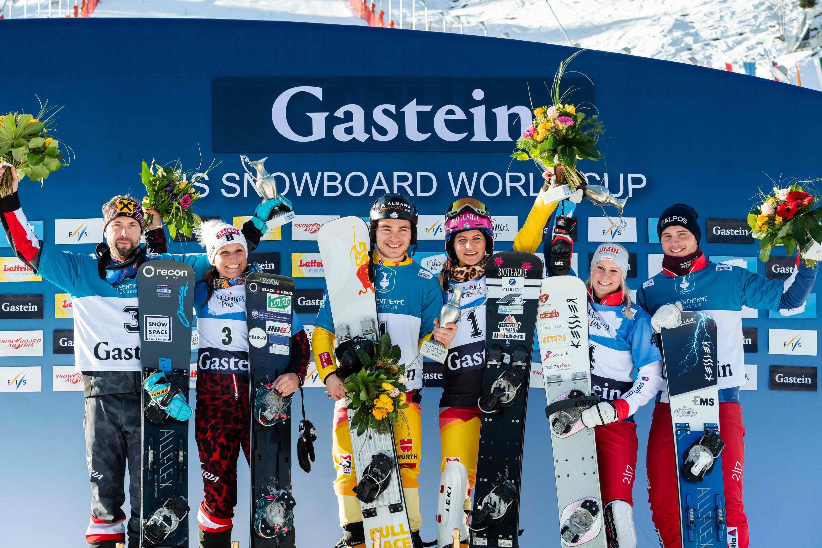 FIS Snowboard World Cup - Bad Gastein AUT - Snowboard Parallel Team Event - Podium with 2nd team Austria1 (RIEGLER Claudia and PROMMEGGER Andreas), 1st team Germany1 (HOFMEISTER Ramona Theresia and BAUMEISTER Stefan) and 3rd team Switzerland 1 (ZOGG Julie and CAVIEZEL Dario) © Miha Matavz/FIS