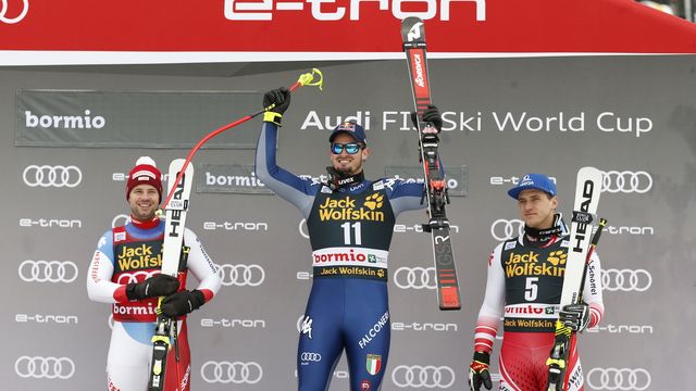 BORMIO, ITALY - DECEMBER 27: Beat Feuz of Switzerland takes 2nd place, Dominik Paris of Italy takes 1st place, Matthias Mayer of Austria takes 3rd place during the Audi FIS Alpine Ski World Cup Men's Downhill on December 27, 2019 in Bormio Italy. (Photo by Christophe Pallot/Agence Zoom)